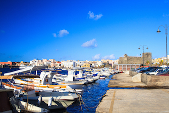 sicily guide holiday information sicilian cities travel sightseeing sicilian islands pantelleria castle harbour fisherboats sea 